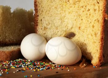 Royalty Free Photo of Two Eggs and Cake