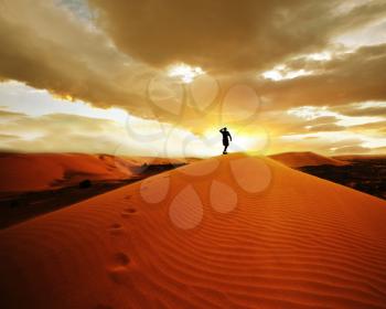 Royalty Free Photo of a Hike in the Gobi Desert at Sunset