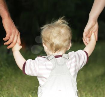 Royalty Free Photo of a Toddler Holding Hands