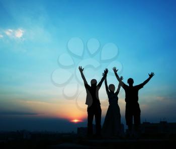 Royalty Free Photo of a Silhouette of Three People