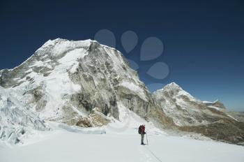 Royalty Free Photo of a Climber on the Ranrapalca Peak in Cordilleras