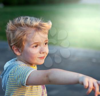 Royalty Free Photo of a Young Boy Pointing