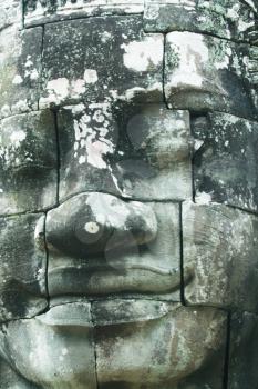 Royalty Free Photo of Stone Buddha Face Statue In Angkor Wat, Cambodia
