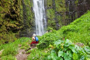 man rest near waterfall