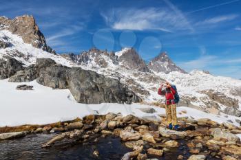 Man with hiking equipment walking in Sierra Nevada mountains, California, USA