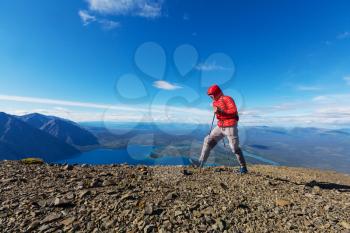 Hiking man in Canadian mountains. Hike is the popular recreation activity in North America. There are a lot of picturesque trails.