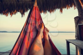 Hammock on the lake at sunset