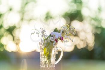 Spring flowers in the glass pot