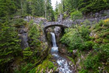 Bridge over a waterfall at Mount Rainier National Park, Washington, USA