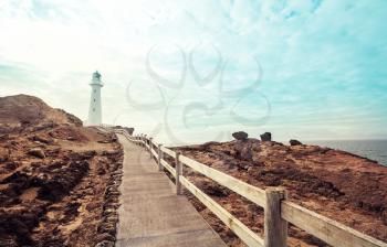 a lighthouse on a picturesque seashore