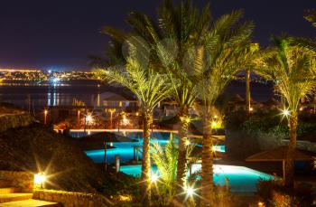 resort swimming pool at twilight