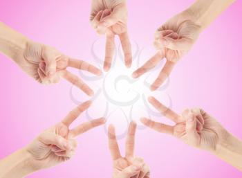 Hands of teamwork , forming the star shape