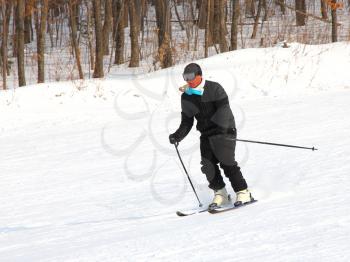 The skier quickly goes from mountain in winter equipment
