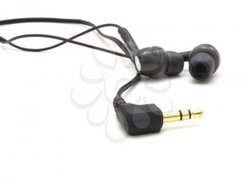 Small ear-phones and the tip for connection on a white background