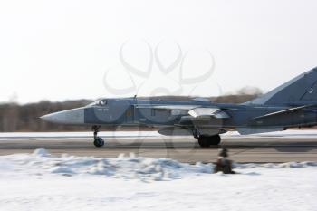 Military jet bomber Su-24 Fencer on take off and landing