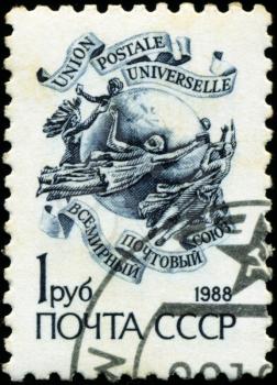 RUSSIA - CIRCA 1988: A stamp printed in Russia shows emblem of the Universal Postal Union, circa 1988