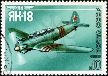 USSR - CIRCA 1986: A stamp printed in USSR shows the Aviation Emblem Yak and aircraft with the inscription Jak-18, 1981 , circa 1986