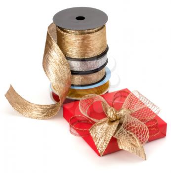 Festive gift box and wrapping ribbons isolated on white background