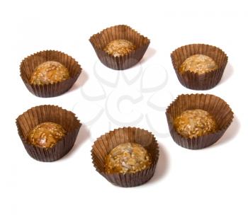 Caramel sweets with sunflower seeds isolated on white
