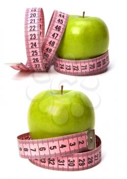 tape measure wrapped around the apple isolated on white background