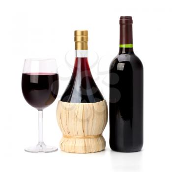 Full red wine glass goblet and bottle isolated on white background