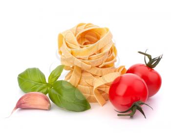 Italian pasta fettuccine nest  and cherry tomato isolated on white background