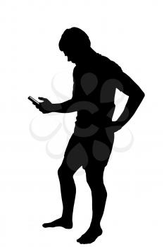 Full length side profile portrait silhouette of a teenage boy texting on smart phone 