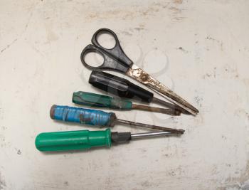 old screwdriver and scissors