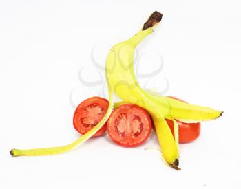 Banana skin and tomatoes insulated on white background