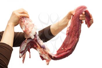 fresh meat in his hands on a white background