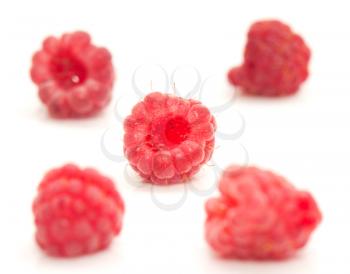 fresh ripe raspberries on a white background. macro