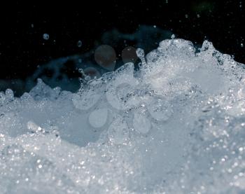 rough water with splashes on a black background