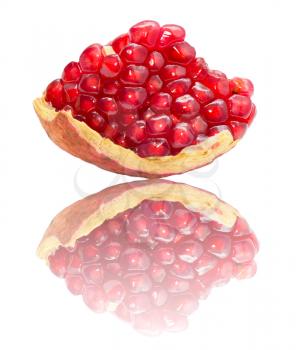 pomegranate with reflection on white background