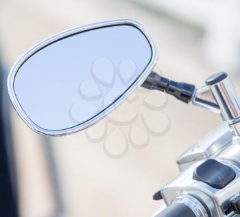 Chromed mirror on motobike as a detail