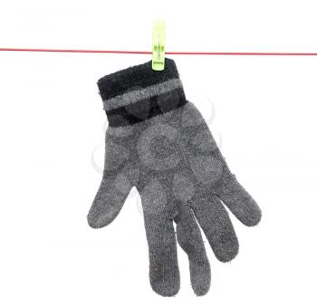 Glove on a rope on a white background