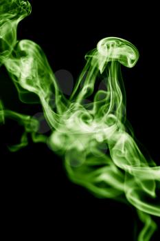 green smoke on a black background