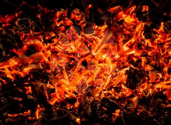 abstract background. burning charcoals with sparks