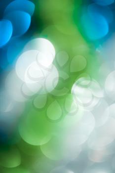 abstract background of a beautiful blue and green festive bokeh