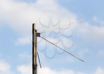 old antenna on a background of blue sky