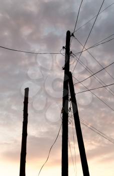 electric pole with wires at sunset