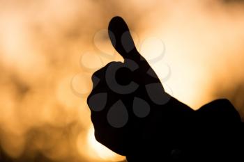 hand on a background of a sunset