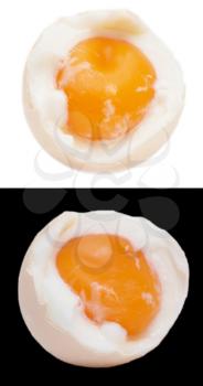 egg with yolk on black and white background