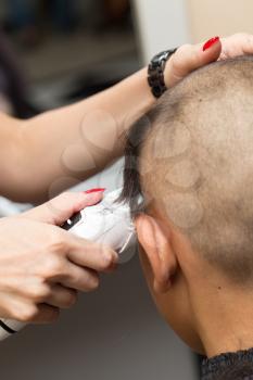 Man having a haircut with a hair clippers