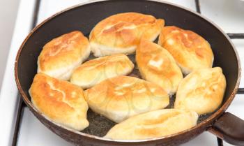 Food patties in a frying pan