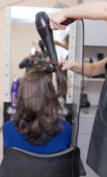 blow-drying in a beauty salon