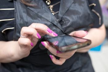 Cell phone in girl's hands