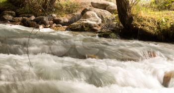 rough water in the mountain river water as a background