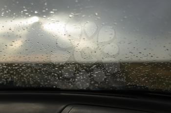 raindrops on a windshield of car