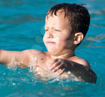 Boy swims in the water park