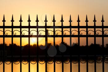 metal fence at sunset